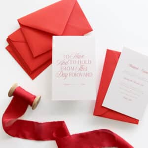 This Day Forward wedding invitation with red writing on pink card