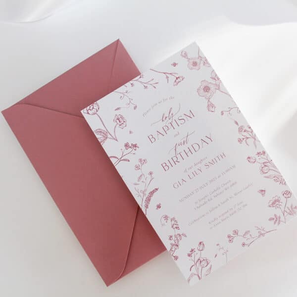 A baby's Baptism Invitation and First Birthday Invitation with pink delicate blossom flowers and soft fonts.